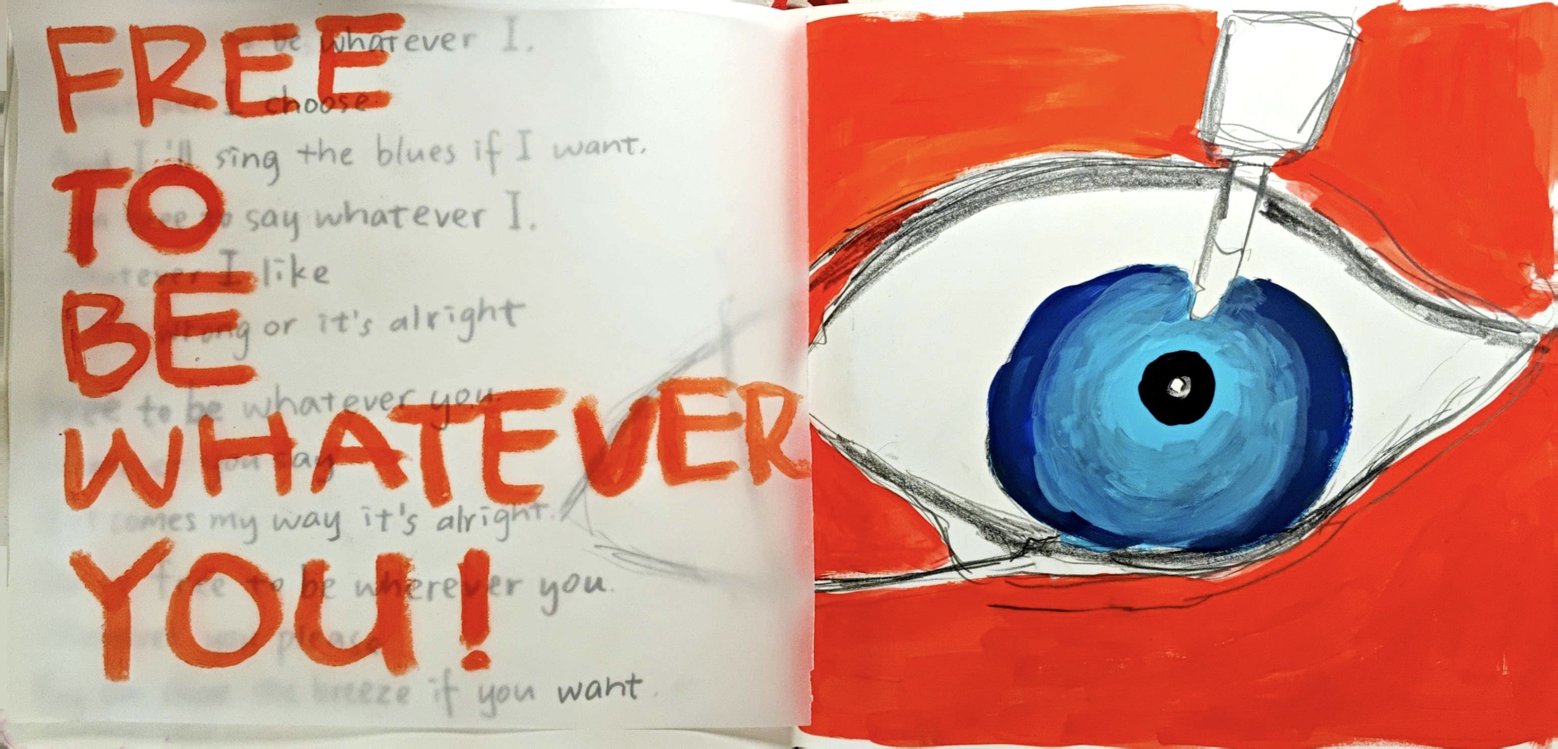 Red sketchbook spread with a large painted blue eye and orange handwritten text.